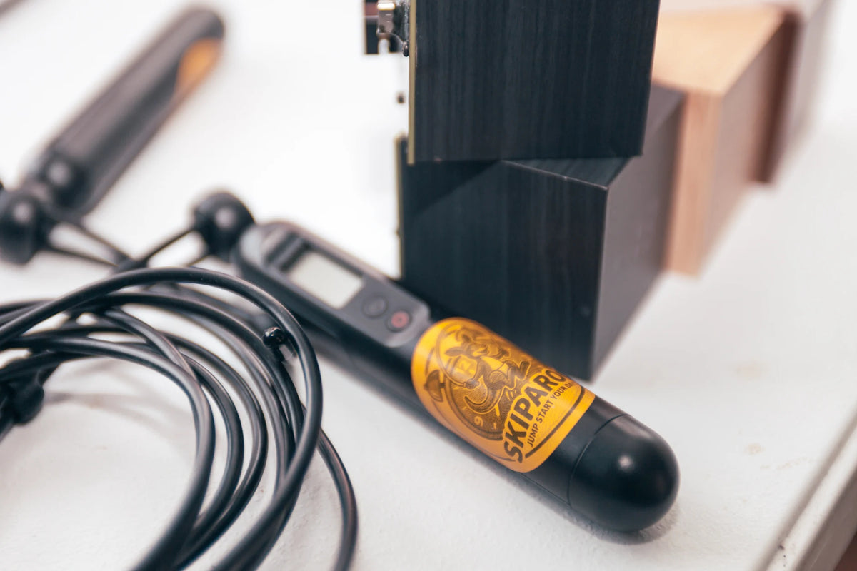 Skiparoo skipping rope handle beside wooden alarm cubes