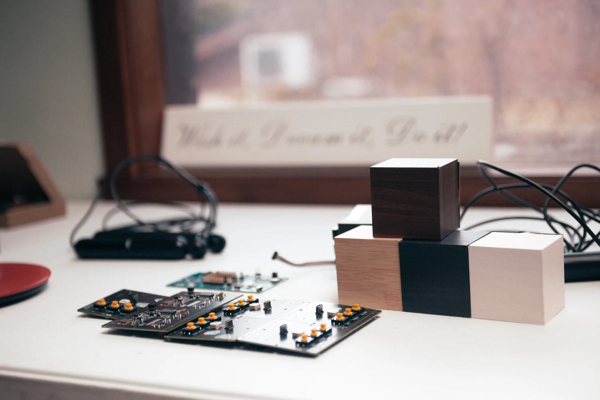 Skiparoo circuit boards, wooden alarm cubes and skipping ropes on the development workbench